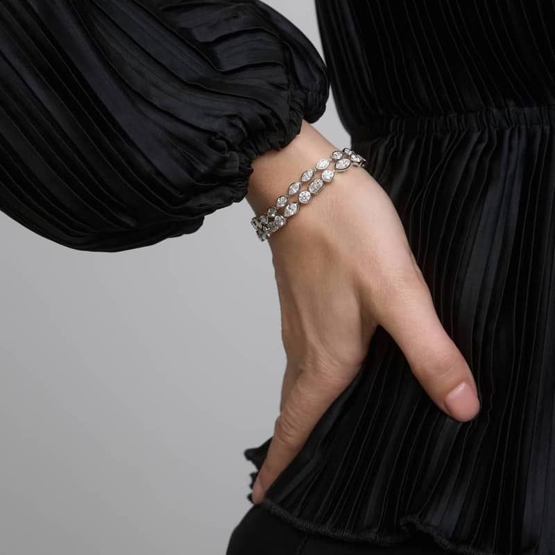 East-West Bezel Tennis Bracelet With 5 CTW Marquise Cut Diamonds in Platinum