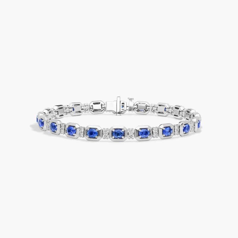 Oval Cut Blue Sapphire and Diamond Alternating Tennis Bracelet In 14K White Gold