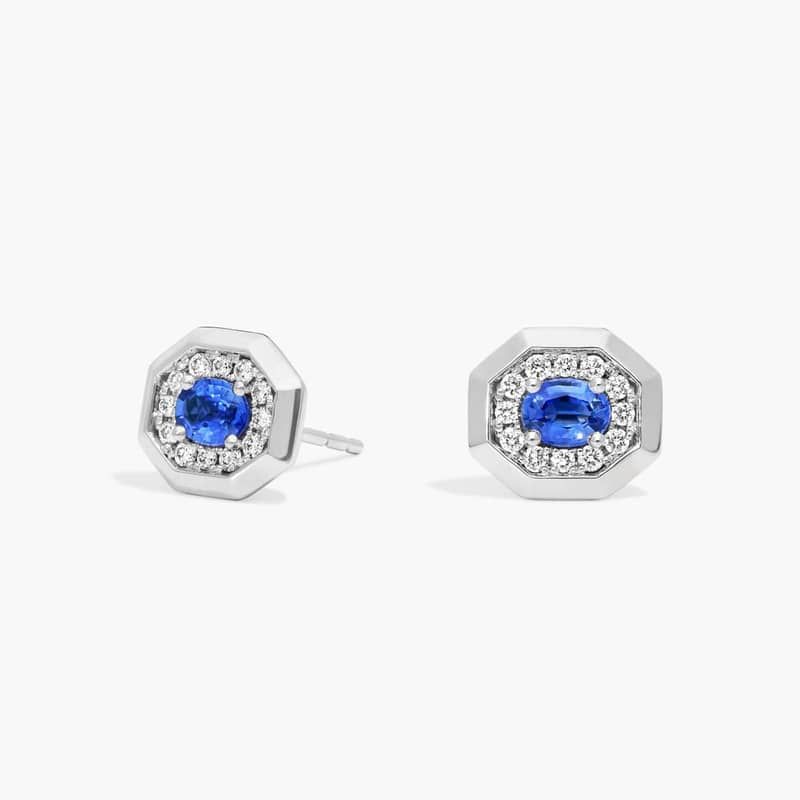 Oval Cut Blue Sapphire and Pavé Diamond Stud Earrings In 14K White Gold