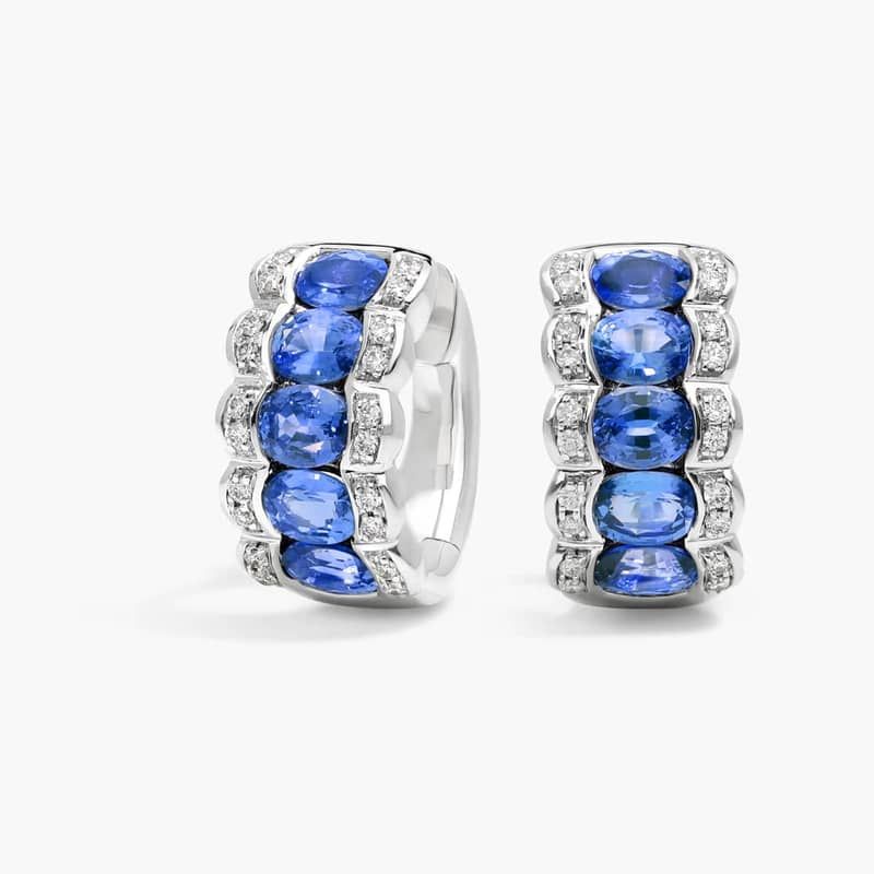 East-West Oval Cut Blue Sapphire and Pavé Diamond Hoop Earrings In 14K White Gold