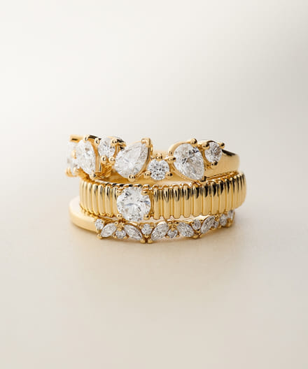 mixed styles yellow gold diamond rings stacked